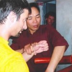 Training on the wooden dummy (Mook Yan Chong)