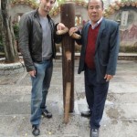 sifu Sergio with sifu Tam Woon Biu with sifu Chan Yiu Ming's original wooden dummy the late GM Ip Man got taught on this dummy