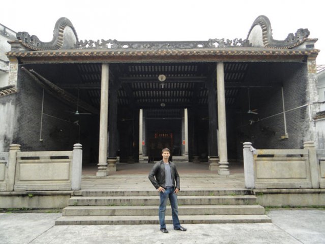 Inside the Chan family ancestral temple behind him the place where the late GM Ip Man got taught by his sihings Ng Chung So and Chan Yiu Ming